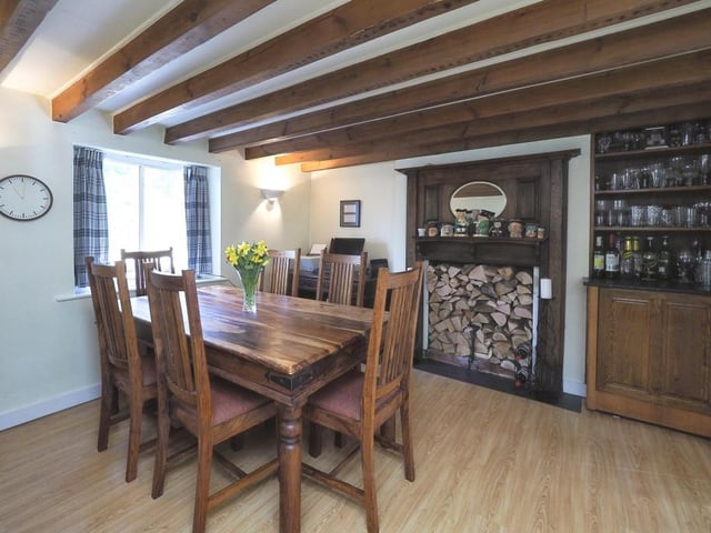 The delightful dining room has more than enough space for a table and chairs. It features laminate flooring, wall lights, a glazed window to the front of the property and double doors opening into the lounge.