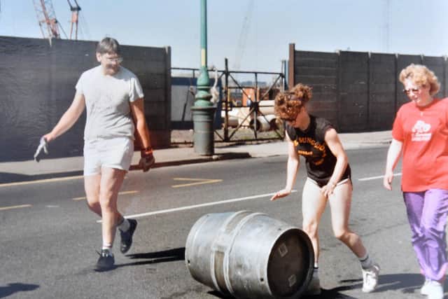Kim Goodrich (centre) taking part in a charity barrel race as it makes its way through the Headland.