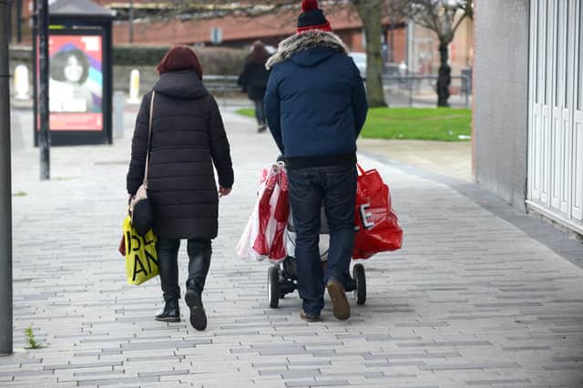 Boxing Day shoppers make their way away from Middleton Grange Shopping Centre, in Hartlepool.