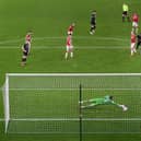 Rotherham striker Matt Crooks (top centre) shoots to score the opening goal past the despairing dive of Boro goalkeeper Marcus Bettinelli.