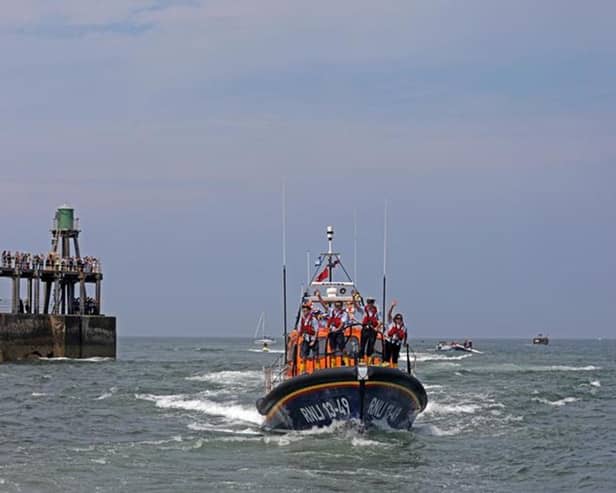 The new lifeboat entering Whitby with Dennis, Jack and Jock's names on the RNLI 13-49 Decal.