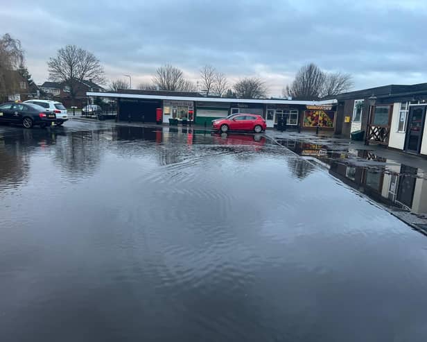 The flooded car park at the Whitehouse Road shops. Picture: Cllr David Reynard.