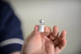 A vial containing covid vaccine.