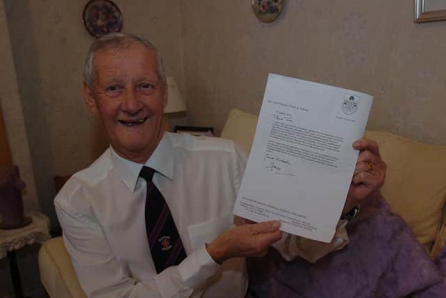 Tom Harvey with his letter telling him he had been made a life member of Durham County FA.