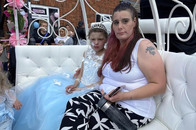 Keisha Watson in the carriage with her mum Natalie.