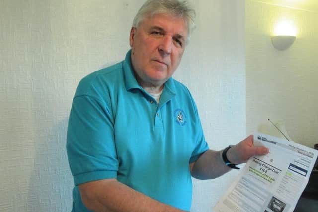 Adrian Beadnell with his parking penalty notice.