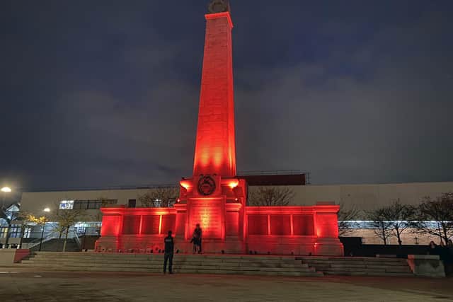 Hartlepool War Memorial, in Victoria Road, Hartlepool, bathed in red on Armistice Day.
