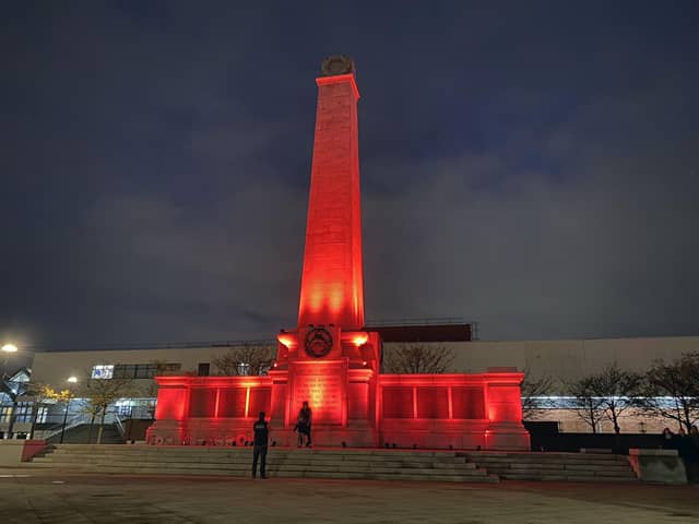 Hartlepool War Memorial, in Victoria Road, Hartlepool, bathed in red on Armistice Day.
