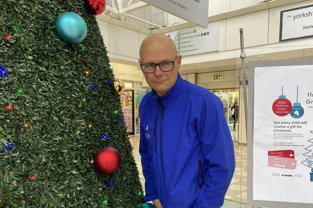 Middleton Grange Shopping Centre manager Mark Rycraft with the Christmas Giving Tree appeal. Picture by FRANK REID