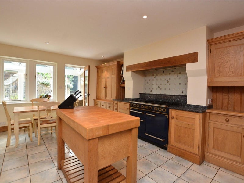 The spacious breakfast kitchen is fitted with a range of oak wall and base level units with granite work tops, complete with a range of integrated appliances, a free-standing butchers block and dining area.