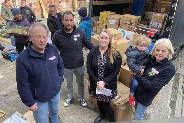 (Left to right) Graham, Kevin, Lyndsey and Helen Hogg with their grandson Charlie as items are being loaded into a van at Hogg Global Logistics with donated items. Picture by FRANK REID