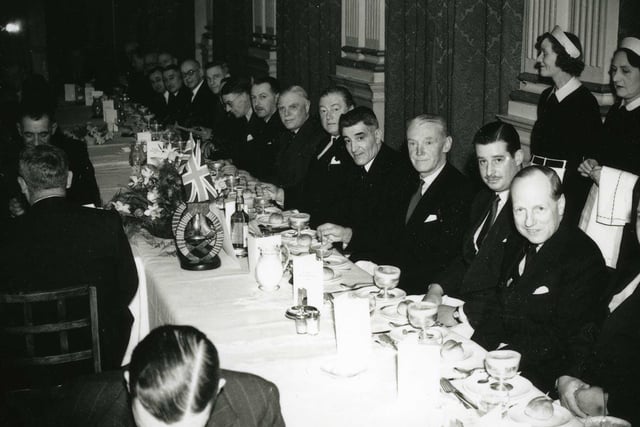 Staff prepare to serve Sir William Gray and his shipyard foremen during a dinner at the Grand Hotel in 1953.