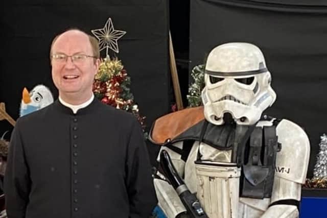 Father Kyle McNeil, from St Mary's Church, in Horden, meets a Stormtrooper at the Christmas fair.