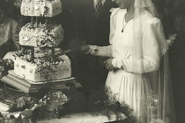 Robert and Mary cut their wedding cake.
