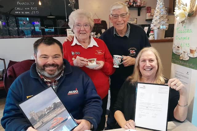Cafe owner, Kathryn O Kane, (centre), is presented with a letter of thanks and a framed picture of the Hartlepool lifeboat by Hartlepol RNLI chairman Malcolm Cook (top right). Also pictured is Hartlepool RNLI coxswain, Robbie Maiden, and enterprise branch fundraiser, Anne Wray.
