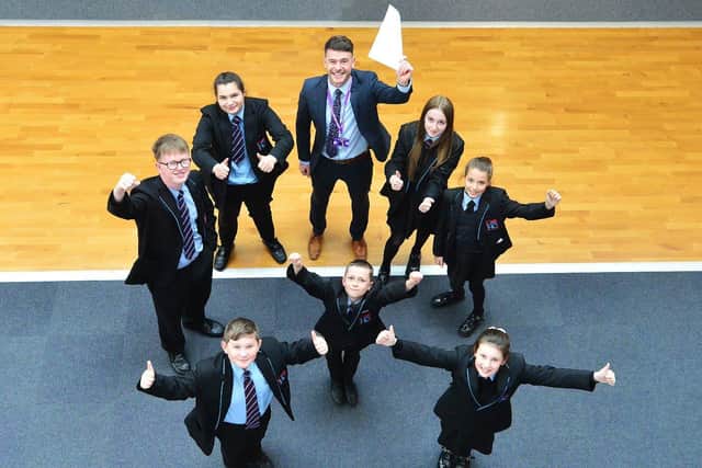 Adam Palmer, principal of Dyke House Academy, celebrates their Outstanding Ofsted report with pupils Alisha Hall, Olivia Rochford, Lexi Greig, Ellie Mae Cooper, Liam Gray, Luke Robinson and Keegan Crossling. Picture by FRANK REID