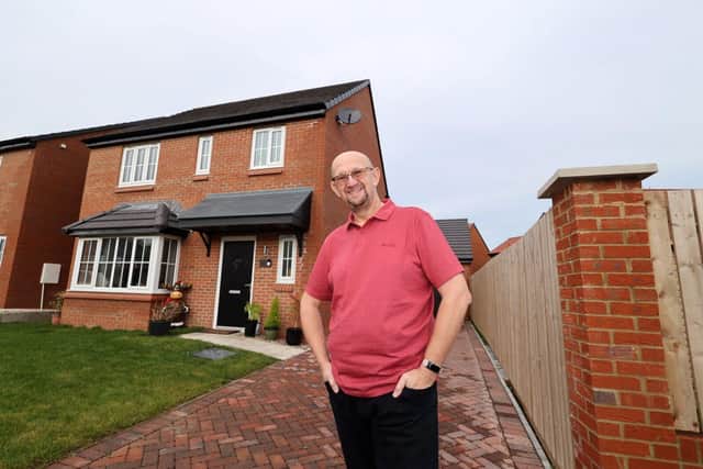 Proud owner Colin Renshaw outside the front of his new house at Bellway’s Wellfield Rise development