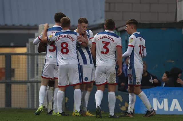 Hartlepool United's Jack Hamilton celebrates with his team mates after scoring their second goal against Rochdale. (Credit: Mark Fletcher | MI News)
