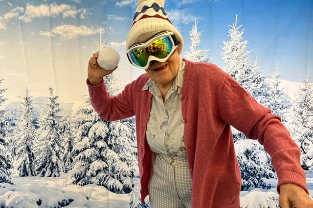 Resident Anne MacDonald, 89, enjoying a snowball throwing game.