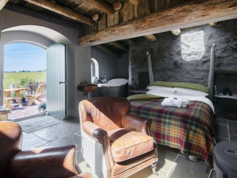Enjoy reading Toklien in a comfortable armchair under wooden beams.
