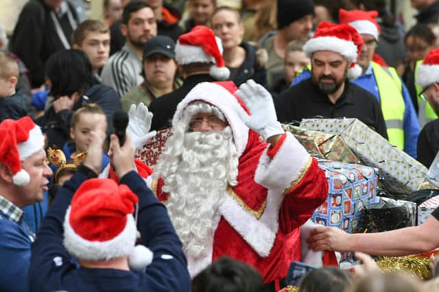 Santa Claus arriving at Middleton Grange Shopping Centre last year.