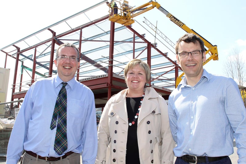 Doctors David Powell and Andrew Fisher and Practice Manager Sally Culmer in front of the new surgery being built on the site of Sett Valley House in 2010