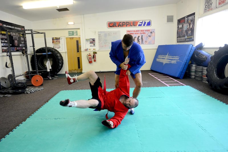 Practising wrestling moves at the gym at Wearside House in 2013 were Barry Gibson (blue) with training partner Steve Taylor.