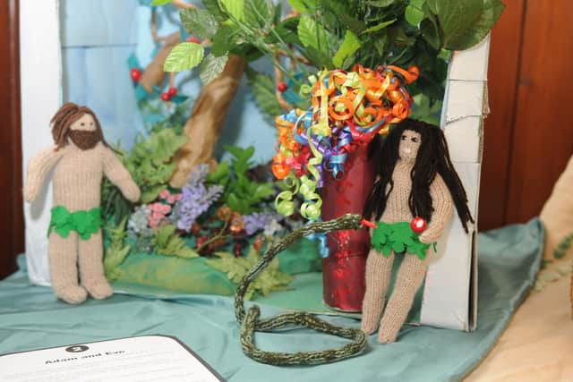 Adam and Eve and the serpent.