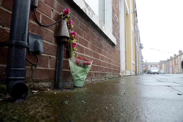 Flowers left in Rydal Street after Michael Phillips' death. Picture by FRANK REID