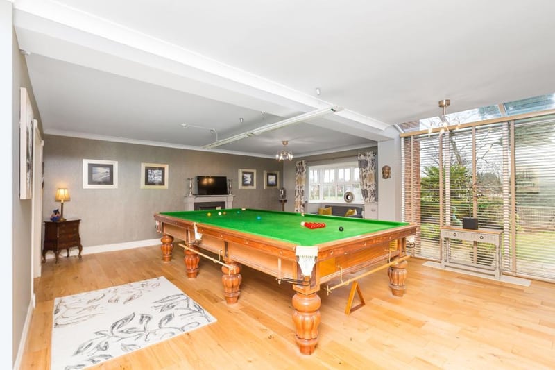The current owners have put a pool table in what was the dining room, highlighting how much space is available.