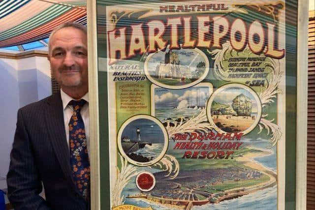 Stephen Close with the latest framed Healthful Hartlepool poster from the early 1900s being auctioned off for the replacement Boer War statue project.