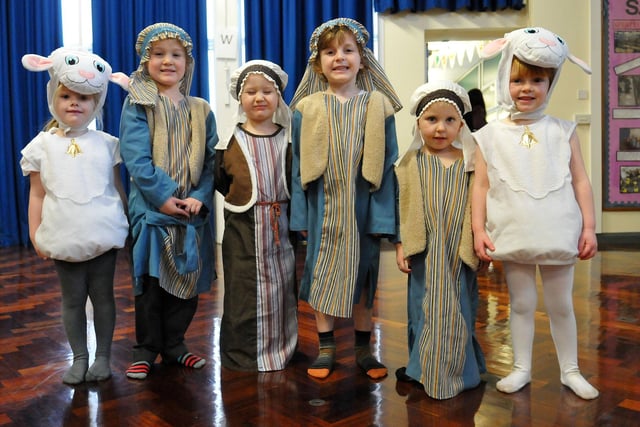 Pupils dress up as shepherds and sheep for their 2014 nativity.