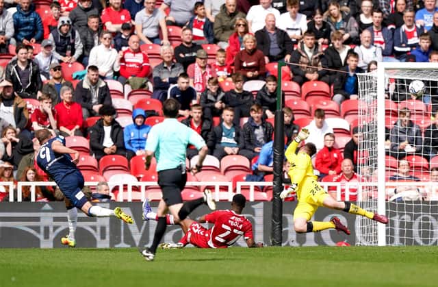 Huddersfield Town's Jordan Rhodes (left) scores their side's second goal of the game during the Sky Bet Championship match at the Riverside Stadium, Middlesbrough. PA picture.