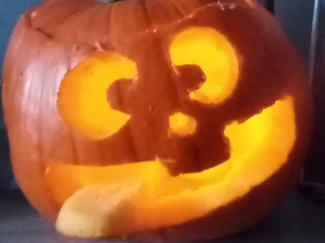 Sticking his tongue out. Celebrating National Pumpkin Day and Halloween with Michelle Potter.