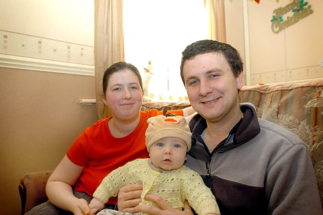 Shaune Benjamin Nicholson, four months-old, celebrates Christmas alongside his parents Amanda and Robert in 2007.