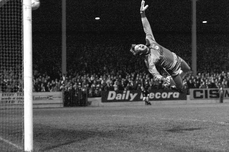 Hibs goalkeeper Alan Rough stretches but can't stop John Colquhoun's second goal during the Hibs v Hearts Edinburgh derby football match at Easter Road in January 1987. Final score 2-2 draw.