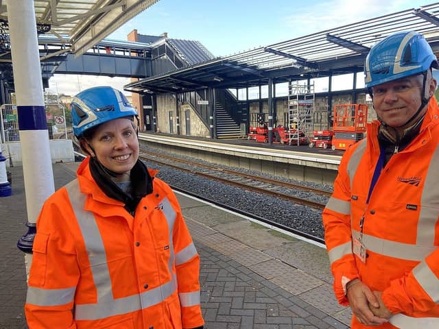 Becky Crocker, from Network Rail, and Matt Croasdale, from Northern, at Hartlepool Rail station with the new bridge and restored second platform behind them. Picture by FRANK REID