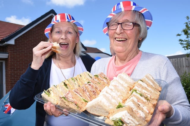 Margaret Turnedge and Mary Redman enjoy a picnic at the Chatham Road Jubilee party.