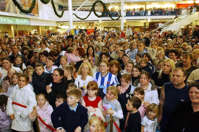 A packed shopping centre. See if you can spot a familiar face.