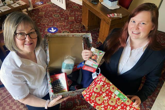 Julia Masshedar (left) and Corina Callan from Mason's Funeral Directors launch the Christmas 2021 Shoebox Appeal. Picture by FRANK REID