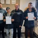 Pictured from left to right: Jordan, Tyler and John with T/Inspector Kelsey and PC Coggin/Photo: Hartlepool Neighbourhood Police Team