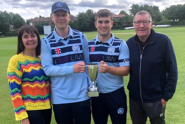 James Piper (centre left) and Ben Scott holding the Ian Jackson Memorial Cup with Ian's wife Louise Jackson and Hartlepool Cricket Club Chair Alan Jackson.
