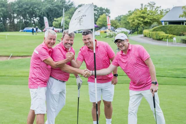 Rob Hoskins, left, with his team at the golf day.