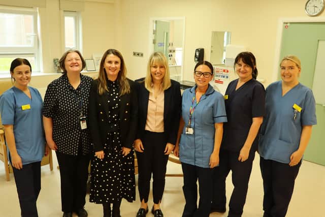 Friends Nicola Burrows, Antonia Nixon and Michelle Keenan (pictured centre from left to right) with members of the chemotherapy unit team at the University Hospital of Hartlepool.