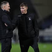 Hartlepool United assistant manager Clint Hill and caretaker manager Tony Sweeney (r)  during the EFL Trophy match between Hartlepool United and Everton at Victoria Park, Hartlepool on Tuesday 2nd November 2021. (Credit: Mark Fletcher | MI News)