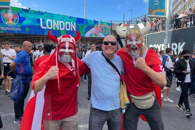 What an atmosphere. Steve,  centre, with two Denmark fans.