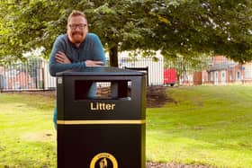 Councillor Jonathan Brash with one the new bins in Burn Valley Gardens.