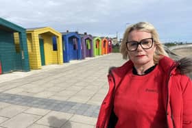 Shonette Bason next to the coloured beach huts at Seaton Carew. Picture by FRANK REID
