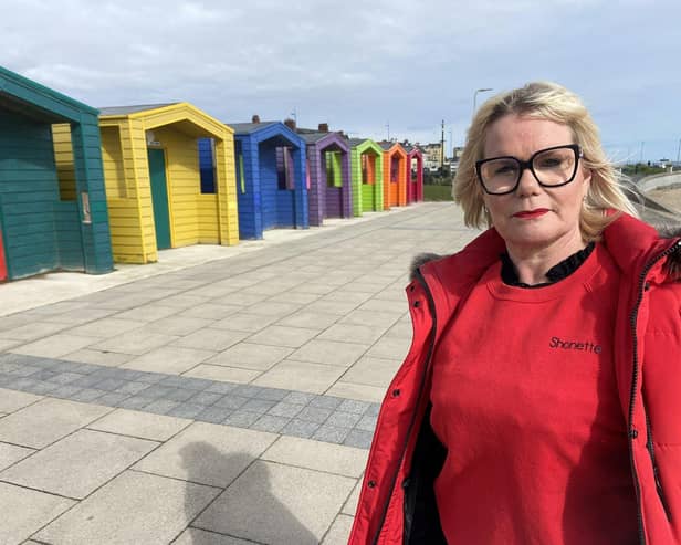 Shonette Bason next to the coloured beach huts at Seaton Carew. Picture by FRANK REID