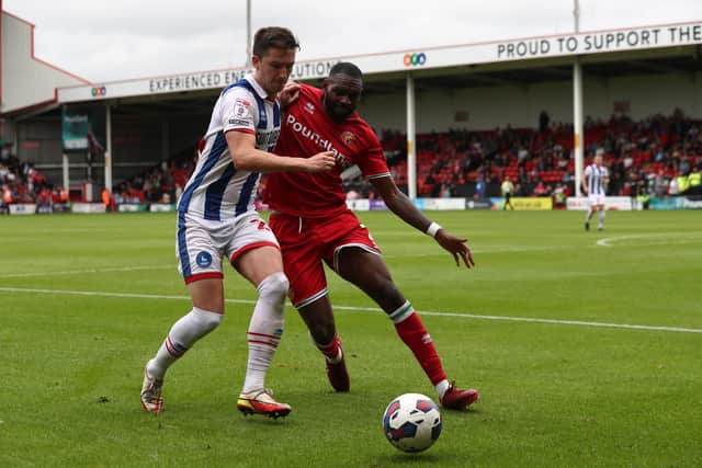 Alex Lacey of Hartlepool United battles with Emmanuel Monthe of Walsall. (Credit: Mark Fletcher | MI News)